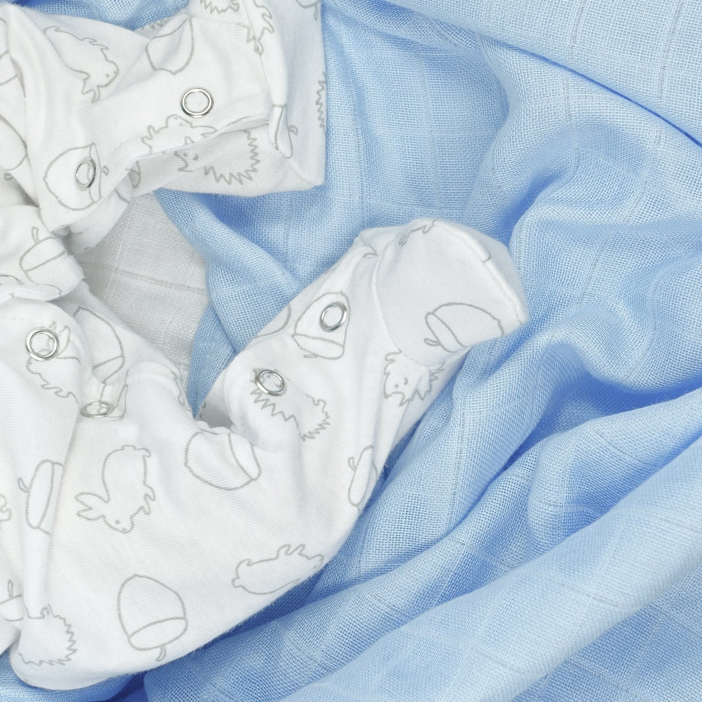 White fabric with black patterns on a blue checkered background