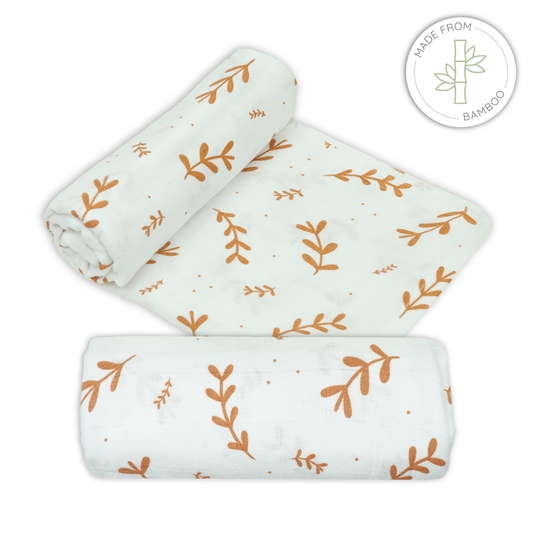 Muslin bamboo swaddles with leaf pattern on a white background for babies