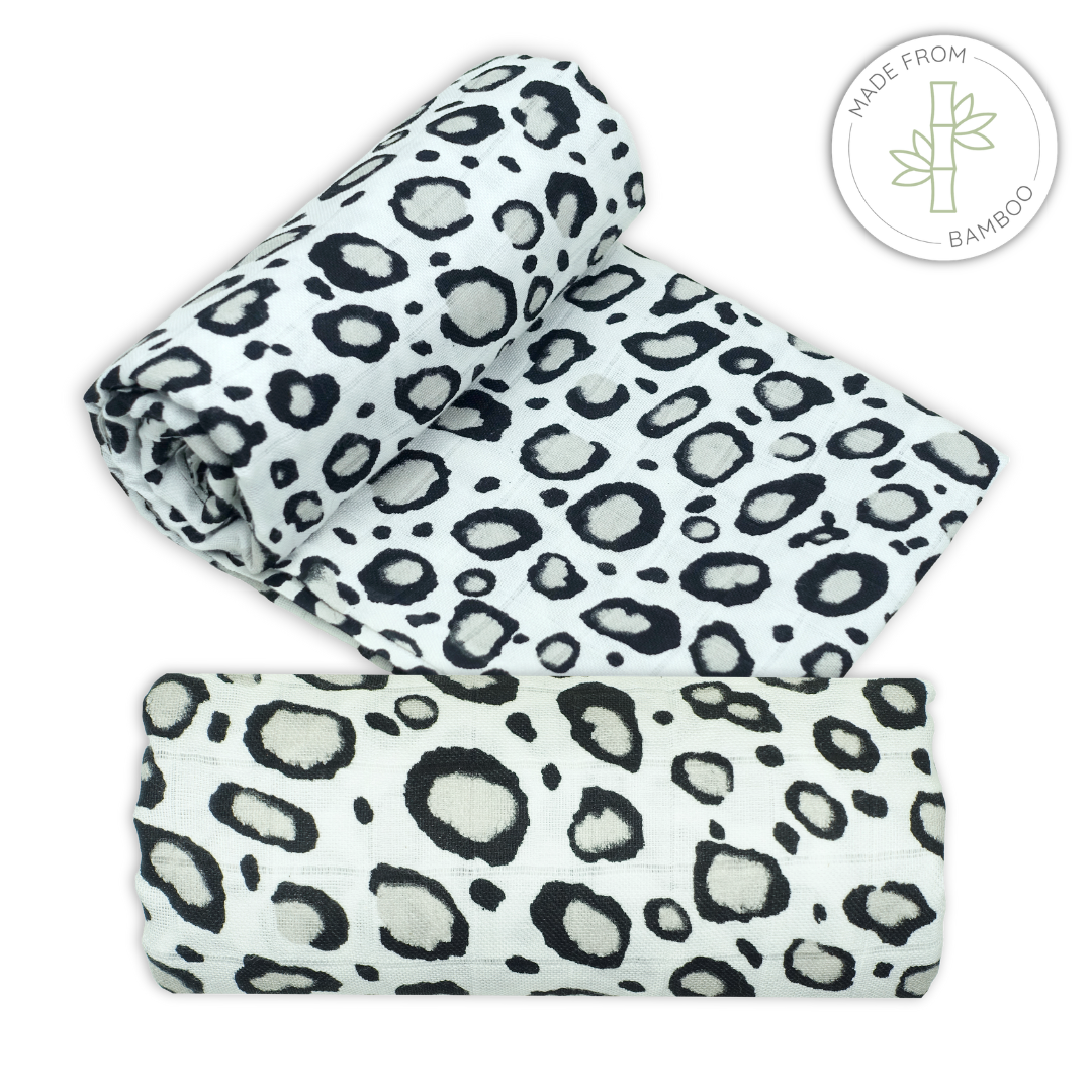 Muslin bamboo swaddles with leopard print black and white sensory pattern on a white background for babies
