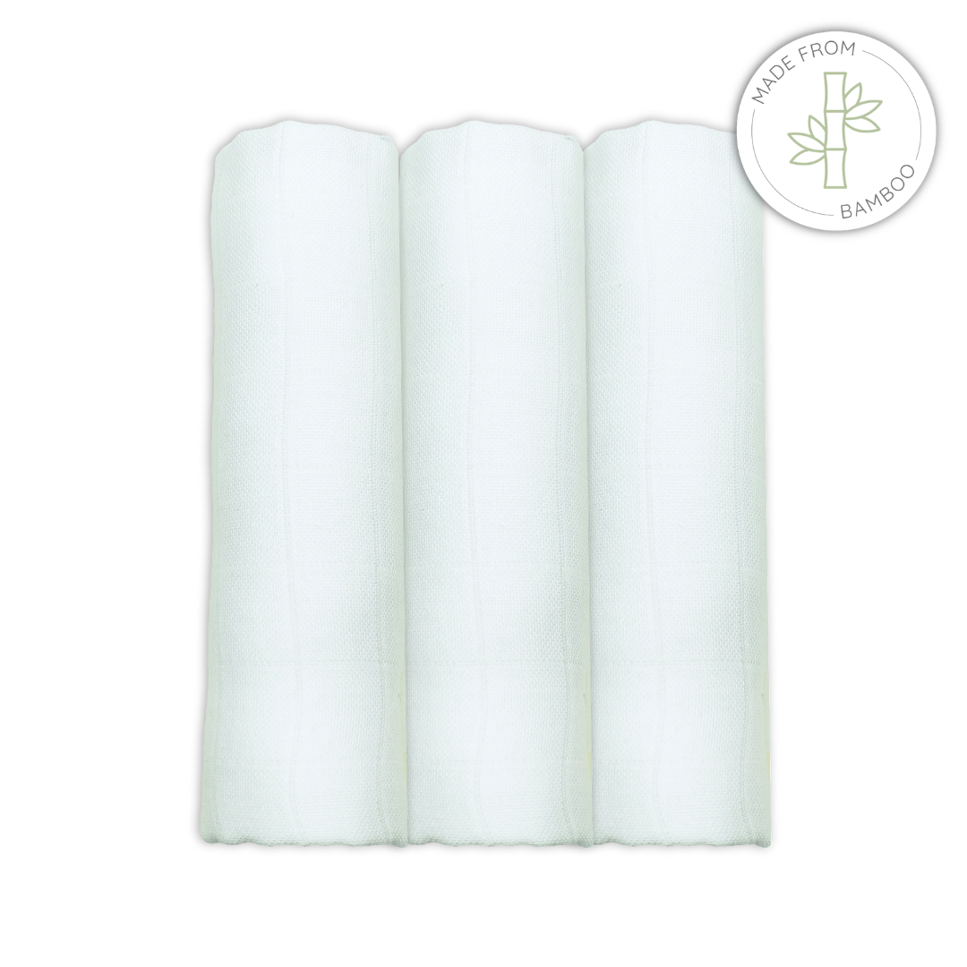 Three white bamboomuslin squares on a white background with a bamboo logo.