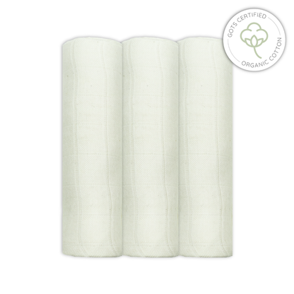 Three rolls of unbleached organic cotton muslins with a certification logo on a white background for babies