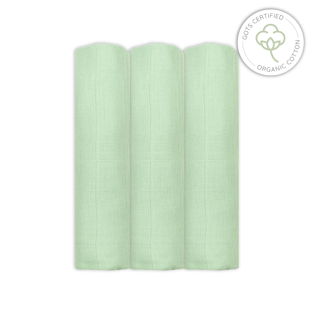 Light sage green baby muslins swatch with GOTS certified organic cotton logo on a white background