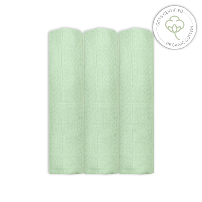 Light sage green baby muslins swatch with GOTS certified organic cotton logo on a white background