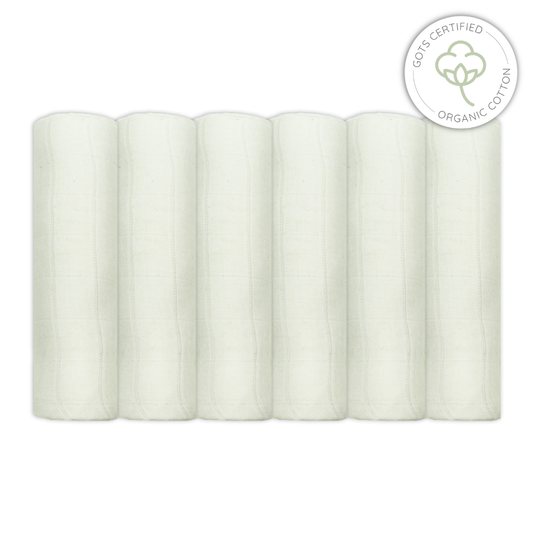 Five rolls of unbleached muslin fabric with a GOTS certified organic cotton label on a white background for babies