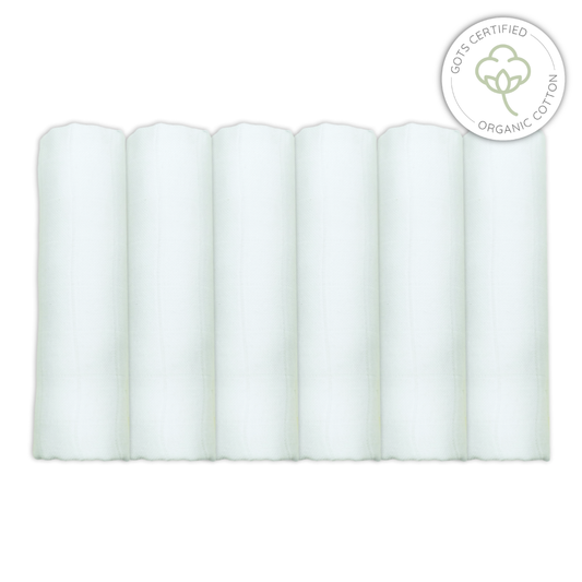 Set of 6 white organic cotton muslins with a certification logo on a white background